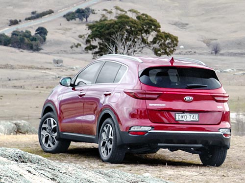 Kia Sportage        - Kia