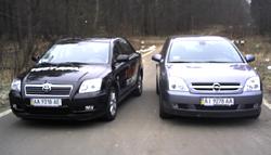 -:  . Toyota Avensis&Opel Vectra